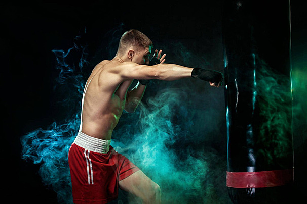 pngtree boxer fighting with punching bag on black background photo image